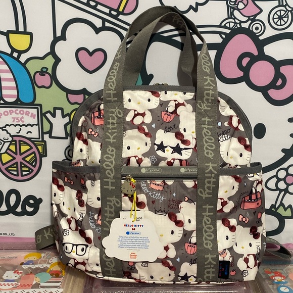 basic backpack grey hello kitty lesportsac Fast Forward for Girls, 16 inch, Red and | Large Durable Sanrio School Bag w/ Front Zip Pocket - Hello Kitty School Supplies renowned for its iconic collaborations and timeless designs LeSportsac Plaid Backpacks | Mercari